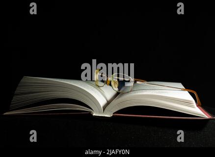 open old book on dark background Stock Photo
