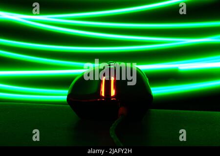 Computer mouse glows in the dark Stock Photo