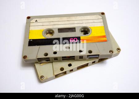 Two audio cassettes on a white background. Old compact cassettes Stock Photo