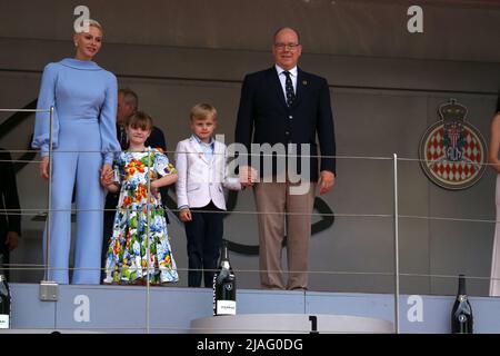 Charlene Lynette Grimaldi (L) , Princess Gabriella Grimaldi (CL), Prince Jacques Grimaldi (CR) and Prince Albert II of Monaco (R),  attend the F1 Grand Prix of Monaco at Circuit de Monaco on May 29, 2022 in Monte-Carlo, Monaco. Stock Photo