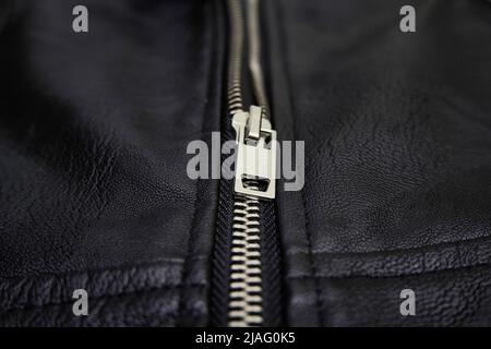 Chrome metal zipper on a leather jacket Stock Photo