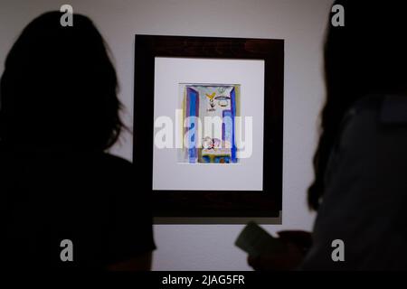 A woman looks at the painting August Macke during the exhibition 'Artist Letters in the Anne-Marie Springer Collection' at the Museo Nacional Thyssen-Bornemisza in Madrid. The Thyssen-Bornemisza National Museum presents, for the first time in Spain, a selection of letters and postcards written by painters such as Delacroix, Manet, Degas, Monet, Cézanne, Van Gogh, Gauguin, Matisse, Juan Gris, Frida Kahlo or Lucian Freud, belonging to the Anne-Marie Springer collection, in dialogue with works by these and other artists in the permanent collection. Stock Photo