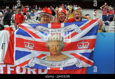 Patriotic England supporters with an image of the Queen at the Stade Bollaert-Delelis in Lens, France during Englands Euro 2016 Group B fixture against Wales on 16th June 2016. Stock Photo