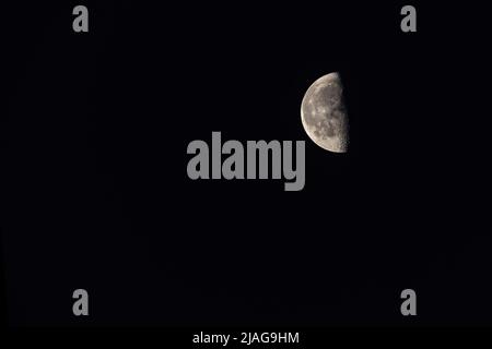Crescent moon on dark night sky Stock Photo