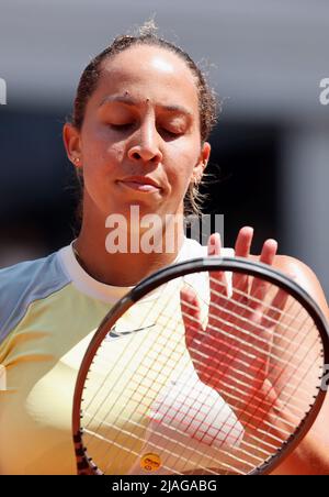 Madison Keys of the U.S. returns a ball during her first round women's