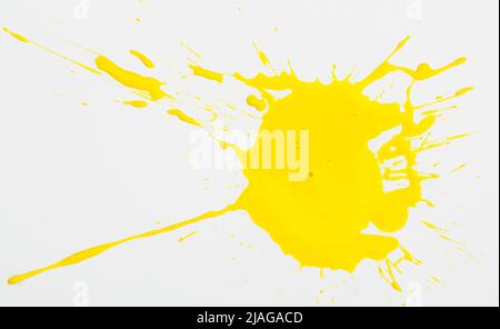 Yellow paint spots on paper, colorfull artistic image on white background Stock Photo