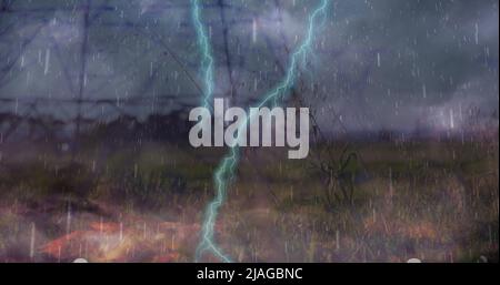 Image of heavy rain, storm with lightning and grey clouds over electric pylons Stock Photo