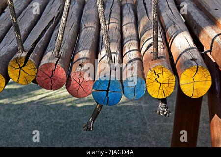 Detail of painted wooden logs used in playground, Rio Stock Photo