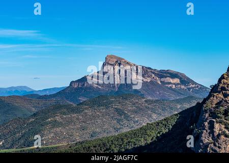 View from viewpoint Santa Cruz de la Seros, Huesca, Spain. The mountains in the background and the blue sky with clouds. Stock Photo