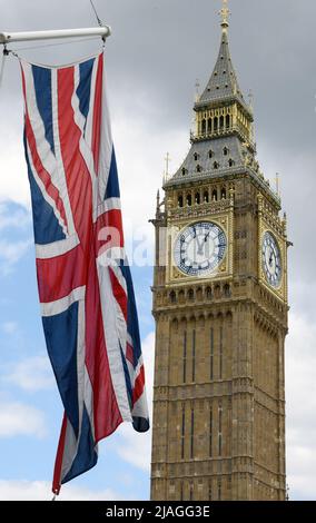 London, UK. 28th May, 2022. The British flag flies in front of Big Ben . To mark the Queen's Platinum Jubilee, marking the 70th anniversary of her accession to the throne, a special extended Platinum Jubilee weekend will take place from June 2 to 5. Credit: Waltraud Grubitzsch/dpa/Alamy Live News Stock Photo