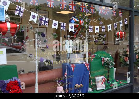 WA Truelove funeral directors shop with Queen's 70th Jubilee decorated shop window, Craddock's Parade, Ashtead, Surrey, UK, 2022 Stock Photo