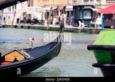 View on Venice city life with detail of gondola close-up by the canal, summer Italy. Stock Photo