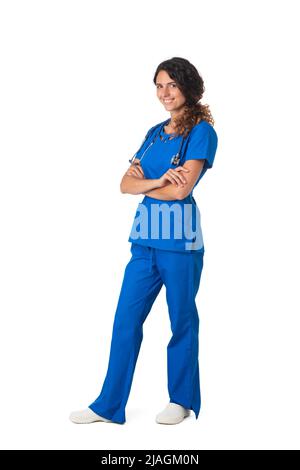 Smiling young woman health care worker standing with arms folded isolated over white background Stock Photo