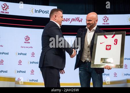 Warsaw, Poland, 30/05/2022, Warsaw, Poland. 30th May, 2022. Cezary Kulesza and Rafal Brzoska shake hands at the press conference. The Polish Football Association officially announced during a press conference at the National Stadium that InPost became the new strategic sponsor.The conference was attended by PZPN's (Polish Football Association) president Cezary Kulesza and Rafal Brzoska, president of InPost, known as Poland's parcel king, who invented the automated e-commerce lockers. It is estimated that approximately 16 million Poles use InPost's automated parcel lockers. Credit: SOPA Images  Stock Photo