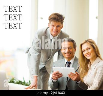 serious business team with tablet pc computers, documents having discussion in office Stock Photo
