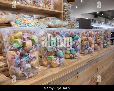 Mill Creek, WA USA - circa May 2022: Angled view of colorful taffy for sale inside a Town and Country grocery store. Stock Photo