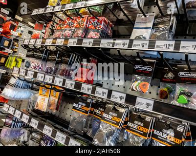 Lynnwood, WA USA - circa May 2022: Angled, selective focus on guitar picks for sale inside a Guitar Center store. Stock Photo