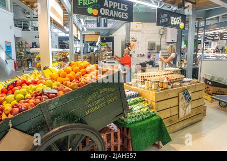 Indoor fruit & vegetable stall at Warrington Market, Time Square, Warrington, Cheshire, England, United Kingdom Stock Photo