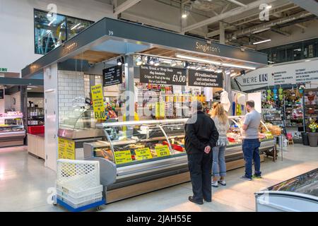 Indoor delicatessen stall at Warrington Market, Time Square, Warrington, Cheshire, England, United Kingdom Stock Photo
