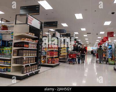 Lynnwood, WA USA - circa April 2022: Angled view of a family shopping together in the grocery section inside a Target store. Stock Photo