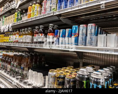 Mill Creek, WA USA - circa April 2022: Angled view of a selection of energy drinks and cold tea for sale inside a Town and Country Market. Stock Photo