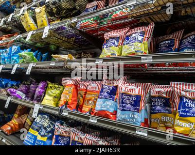 Mill Creek, WA USA - circa May 2022: Angled view of Tim's and Kettle brand potato chips for sale inside a Town and Country market. Stock Photo