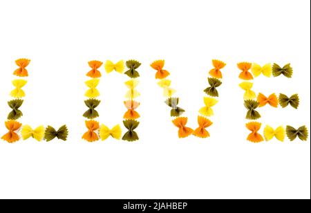 Text Love in English Amor en Español, written with ribbons of three-color pasta on a white background Stock Photo