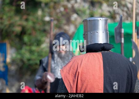 Two knights facing each other during a duel at the annual 'Médiévales' festival in Luzarches, France. Stock Photo