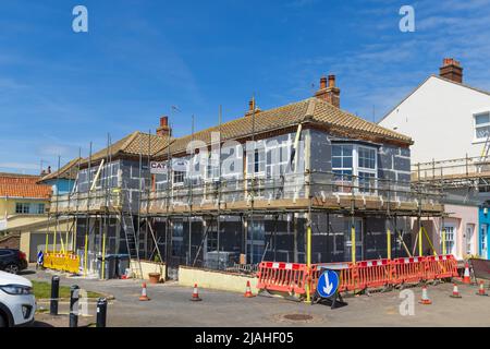 A house having external wall insulation applied to its facade.  Aldeburgh, Suffolk. UK. Stock Photo