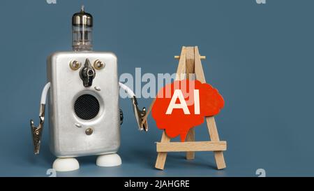 The robot points to the brain with the inscription AI. Stock Photo