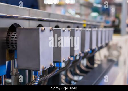 Part of automatic injection molding machine at plastic exhibition Stock Photo