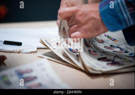 Electoral jury members count votes after elections rally ended during the 2022 Presidential elections in Bogota, Colombia on May 29, 2022. Stock Photo