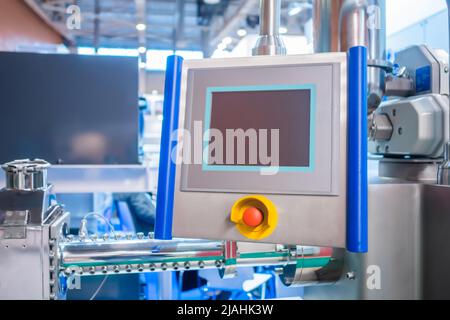 Machine control panel with red push stop button and display Stock Photo