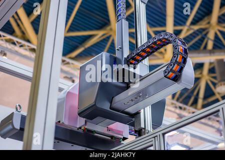 Upper part of plastic injection molding machine at exhibition Stock Photo