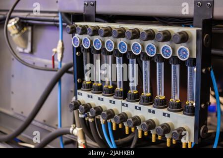 Flowmeter, rotameter - flow regulator for cooling system of injection machine Stock Photo