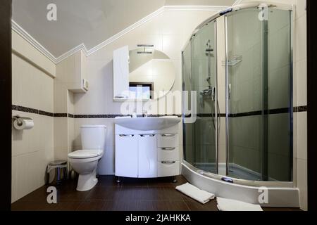 Bukovel, Ukraine February 4, 2022: bathroom with hydrobox, light style interior of the bathroom, baths in Bukovel hotels. Stock Photo