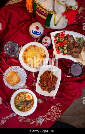 National Kazakh festive table top view. Kazakh table-dastarkhan with different dishes Stock Photo