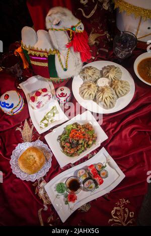 Kazakh table-dastarkhan with different dishes. national Kazakh festive table top view Stock Photo