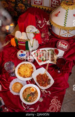 Kazakh table-dastarkhan with different dishes. national Kazakh festive table top view Stock Photo