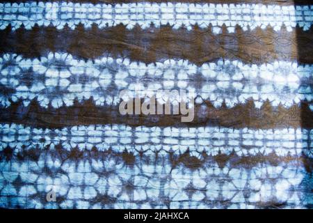 Background in blue and black. Flower pattern with dye effect. Stock Photo