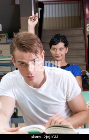 back to school: student asks a question Stock Photo