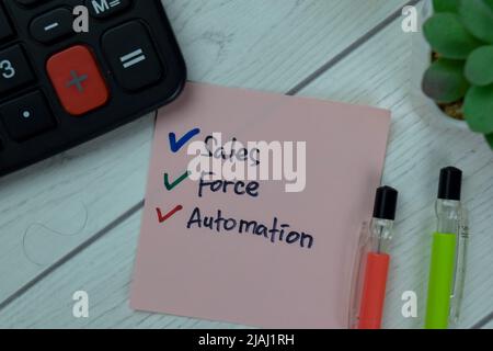 Concept of Sales Force Automation write on sticky notes isolated on Wooden Table. Stock Photo