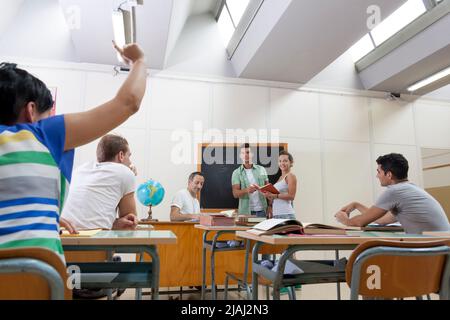 back to school: student asks a question Stock Photo