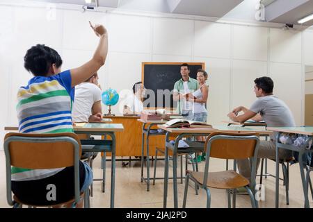 back to school: student asks a question Stock Photo