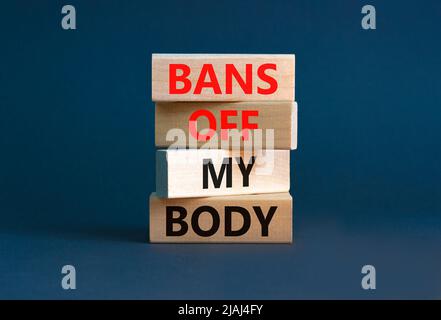 Bans off my body symbol. Concept words Bans off my body on wooden blocks on a beautiful grey table grey background. Women rights concept. Business soc Stock Photo