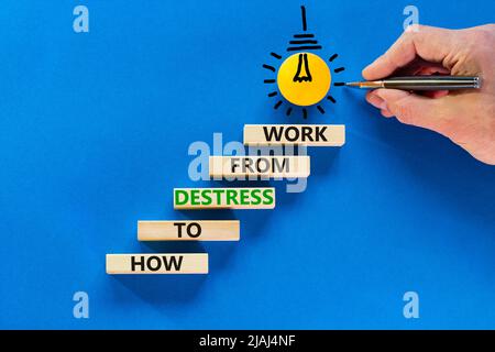 Destress from work symbol. Concept words How to destress from work on wooden blocks. Doctor hand. Beautiful blue background. Psychological business an Stock Photo