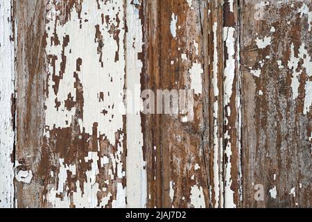 Old wood chipped background, scratched white paint on wooden boards. Old white solid wood slats Rustic shabby frame Background. Stock Photo