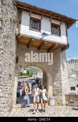 Stari Most Museum and gate to Stari Most (Mosta Bridge) over River Neretva, Old Town, Mostar, Bosnia and Herzegovina Stock Photo