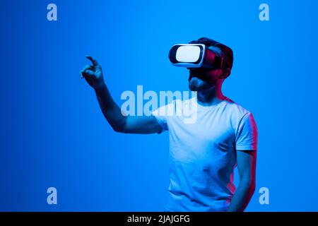 Modern architect, designer using virtual reality glasses at workplace. Designer working in augmented reality vr studio. Man working in VR goggles on a Stock Photo
