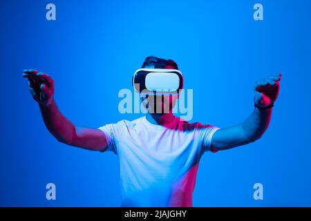 Modern architect, designer using virtual reality glasses at workplace. Designer working in augmented reality vr studio. Man working in VR goggles on a Stock Photo